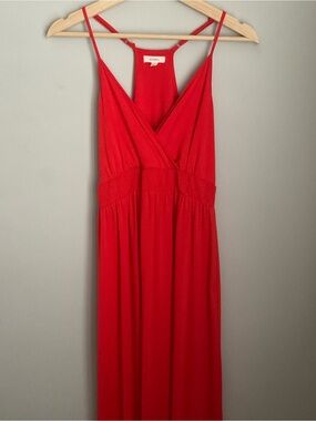 Red Superb brand maxi dress features a smocked bodice and adjustable straps.